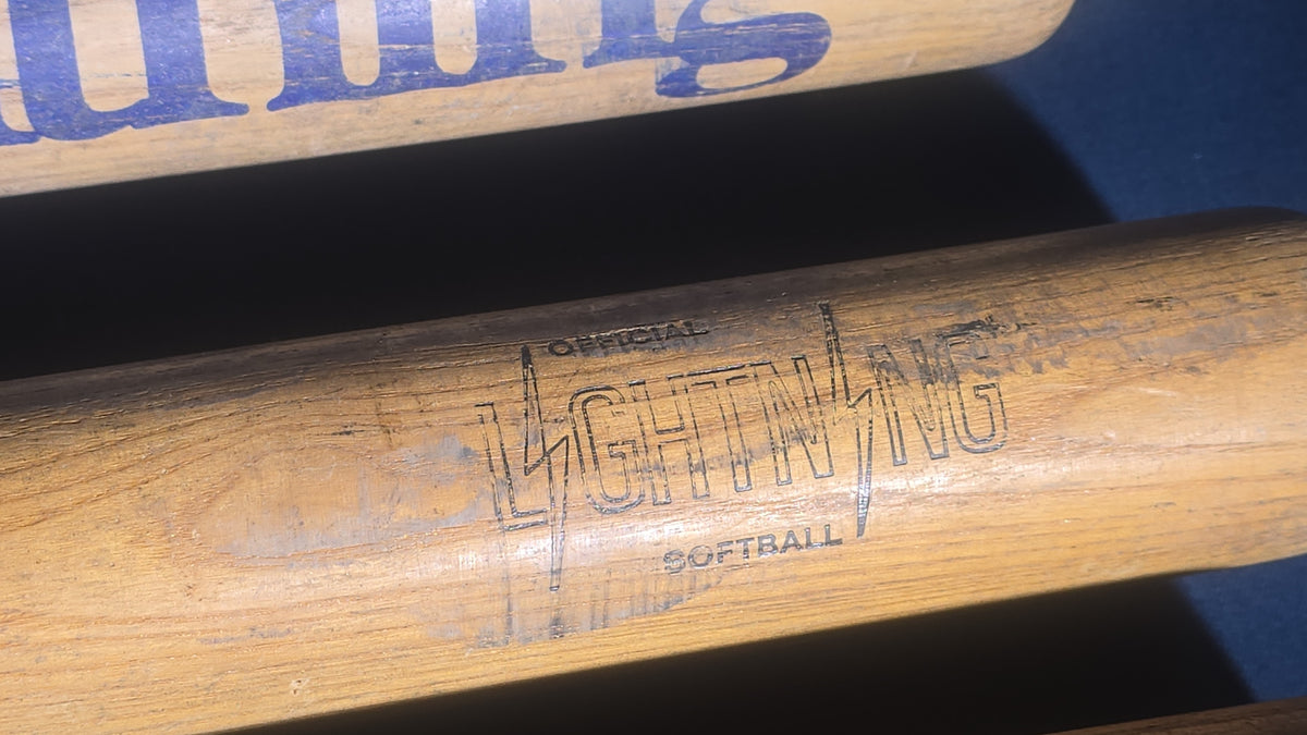 Grouping of Five Vintage Wood Softball Bats including Louisville Slugger and Official Lightning