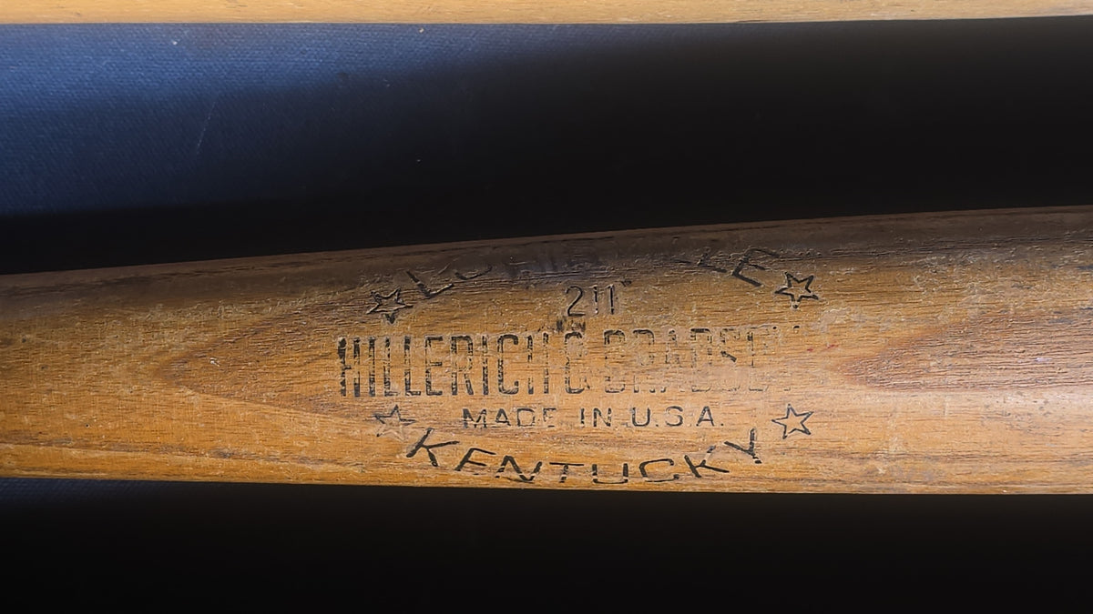 Grouping of Five Vintage Wood Softball Bats including Louisville Slugger and Official Lightning