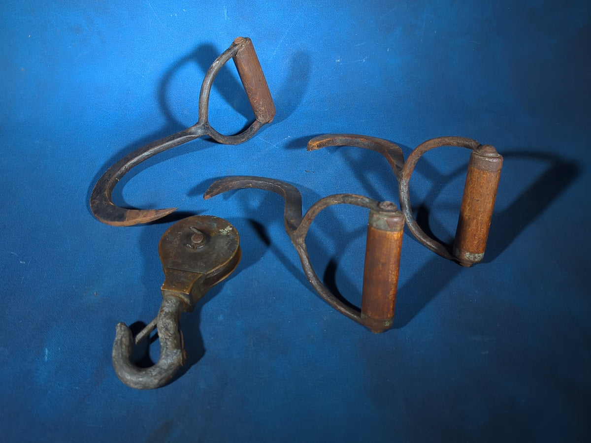 Grouping of Four Antique Iron Hooks including Three Hay/Ice Hooks with Wood Handles and One Pulley Hook