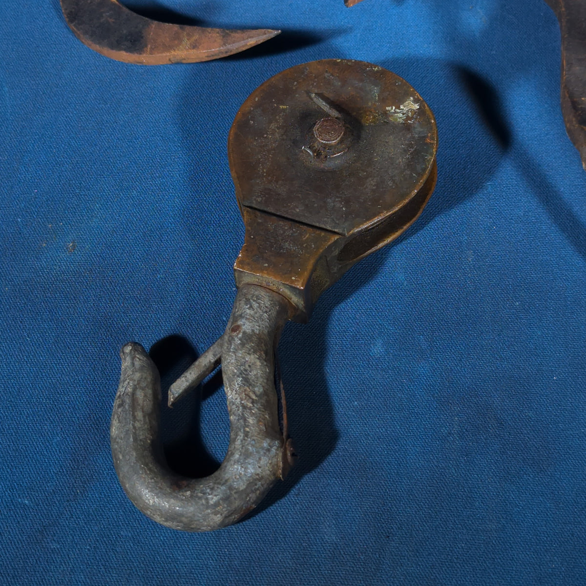 Grouping of Four Antique Iron Hooks including Three Hay/Ice Hooks with Wood Handles and One Pulley Hook