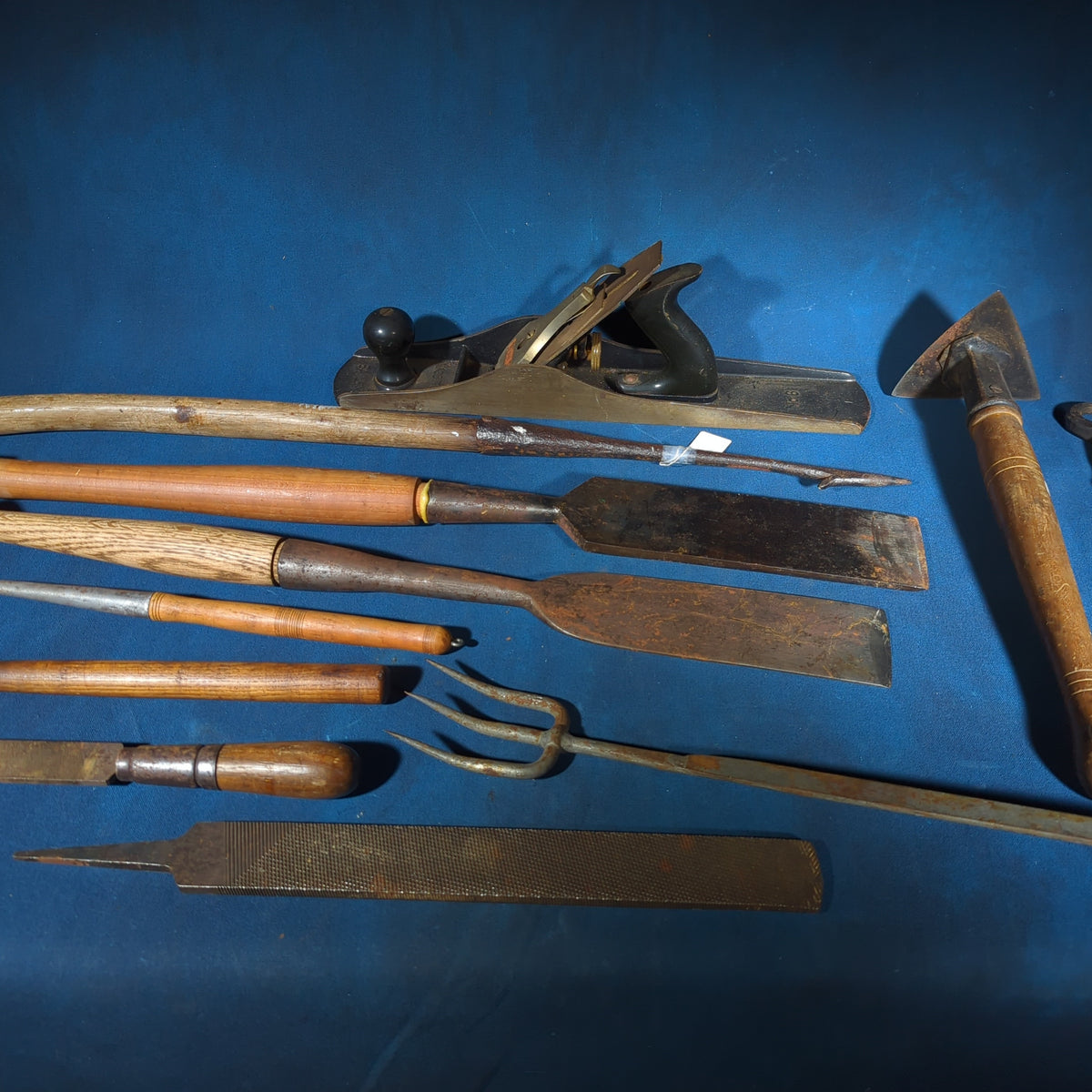 Grouping of Antique and Vintage Hand Tools including Stanley No. 6 Wood Plane, Chisels, Hay Gaff, File, and Twisted Iron Implements