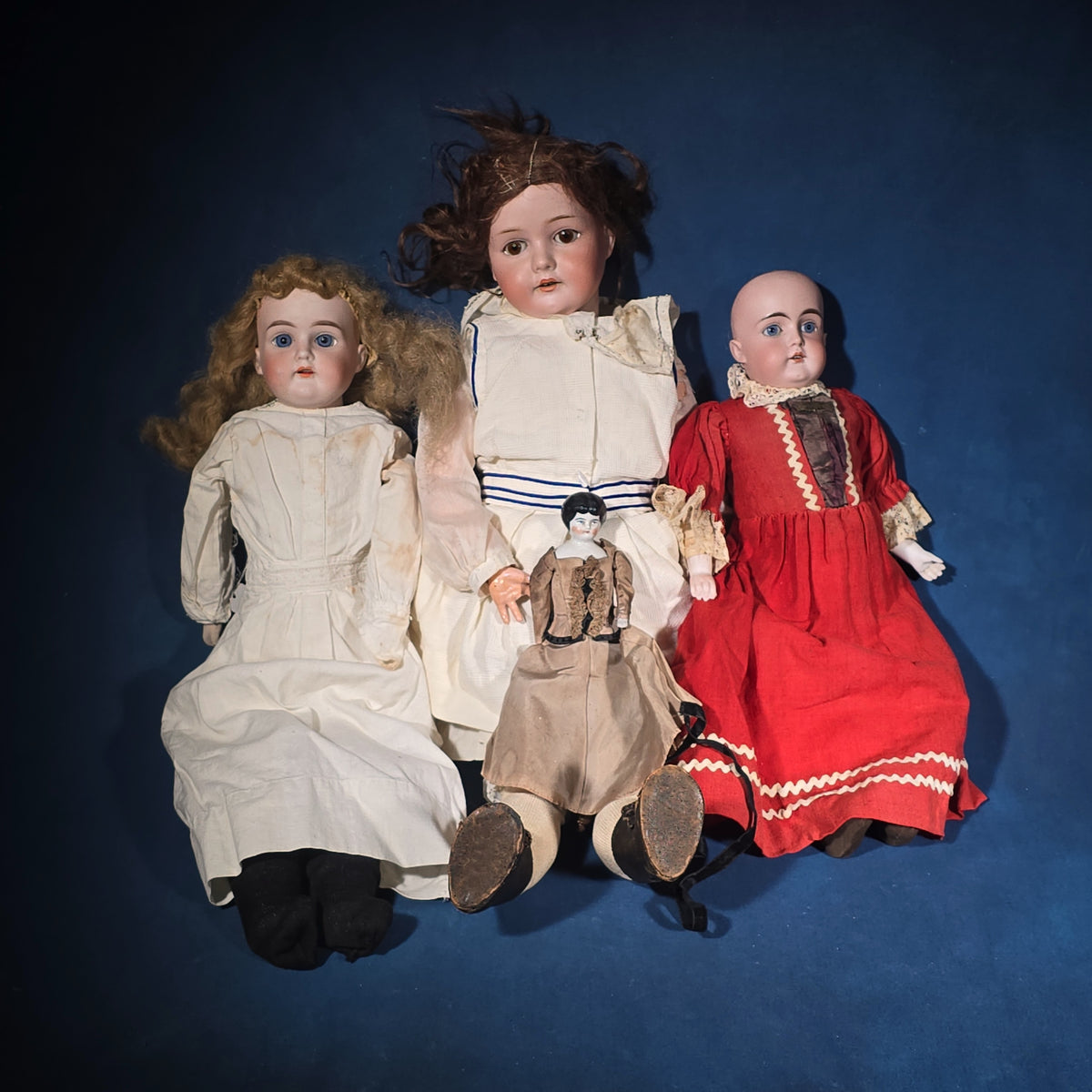 Grouping of Four Antique German Bisque Head and China Head Dolls