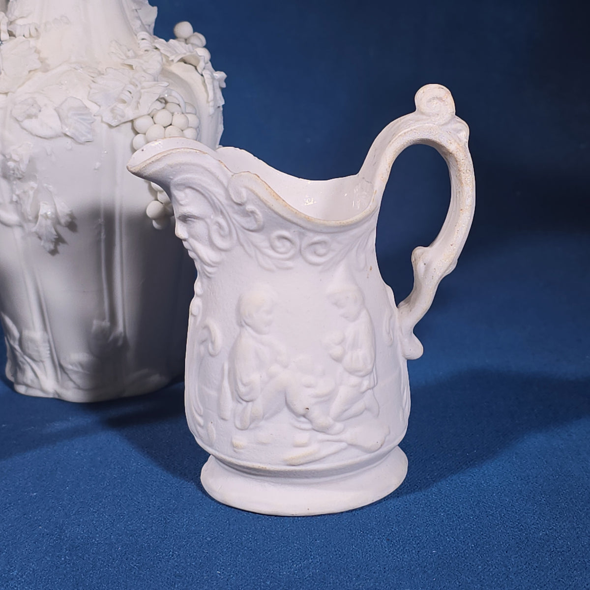Grouping of Four Antique Parian Ware Pitchers and Vases
