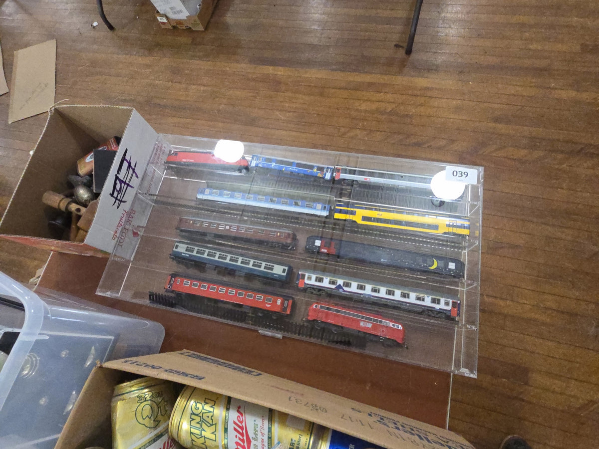 plastic display case with trains