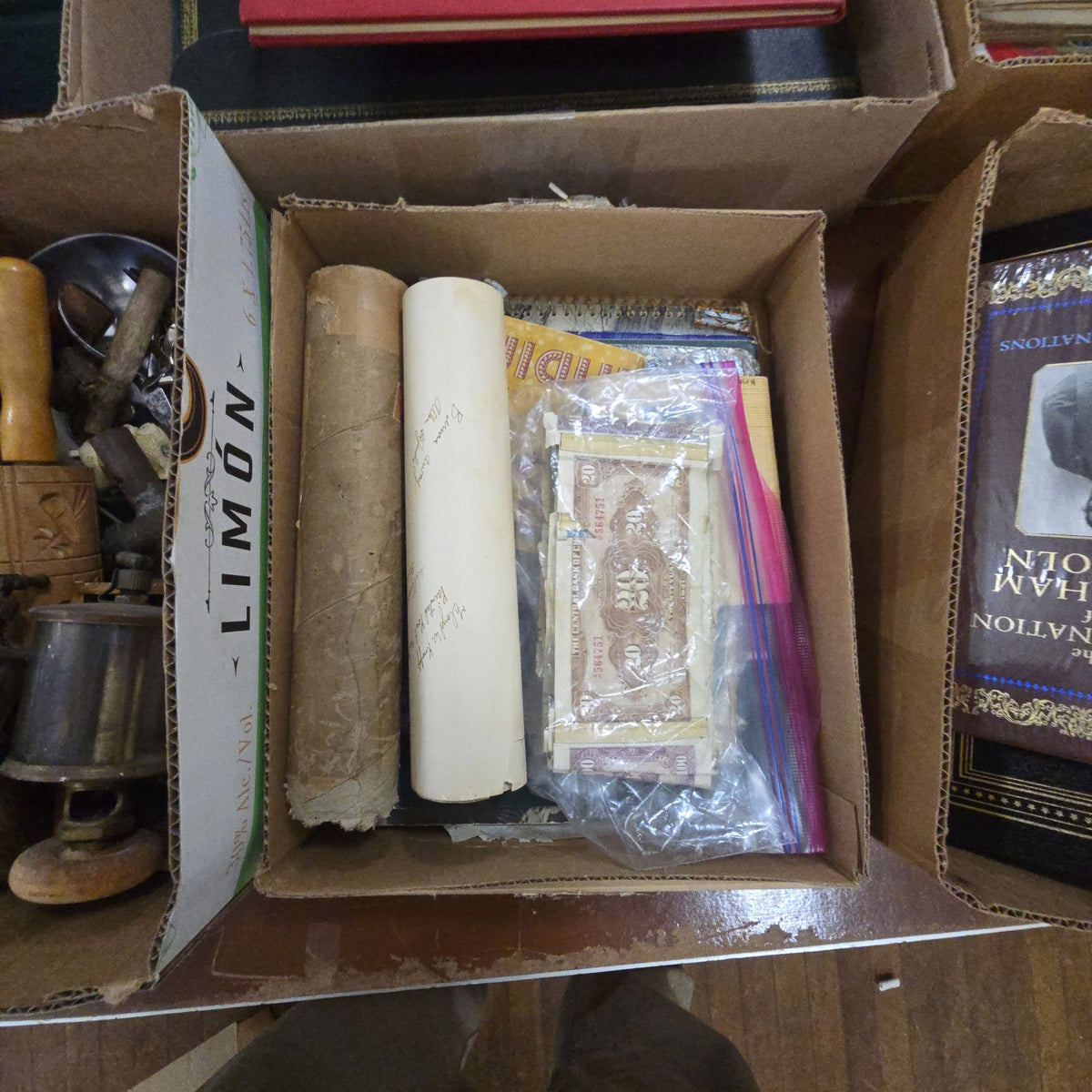 box lot of miscellaneous ephemera including paper currency yardlong photo and travel guides