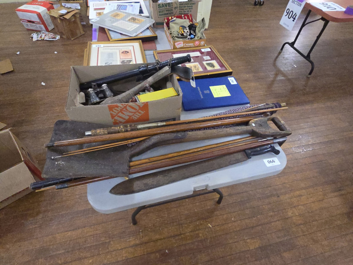 grouping with antique shovel, fishing pole, canes, and machete