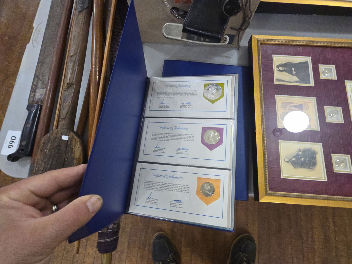 two binders with commemorative coins from the British Virgin Islands