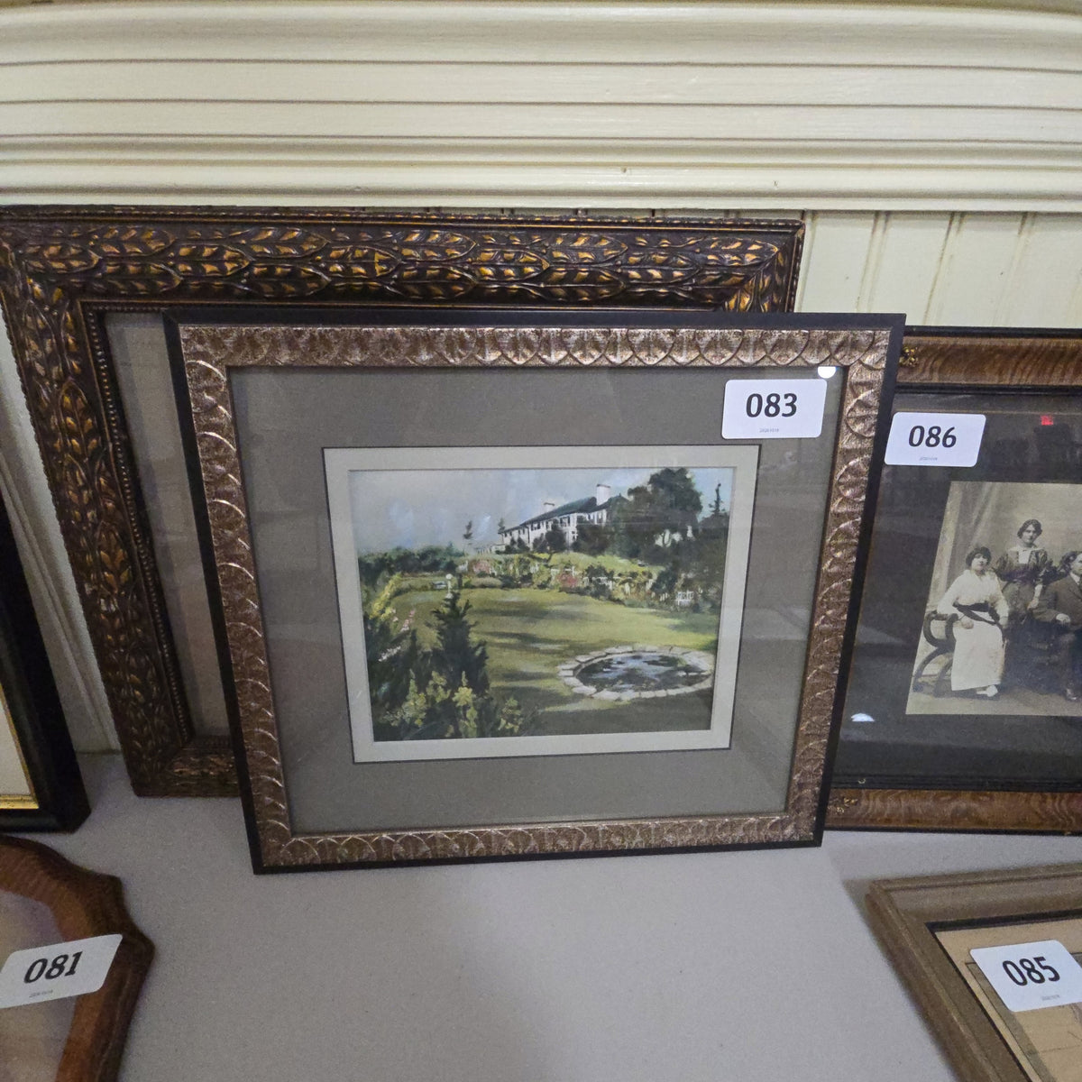 vintage painting of house in frame with photo of house on back
