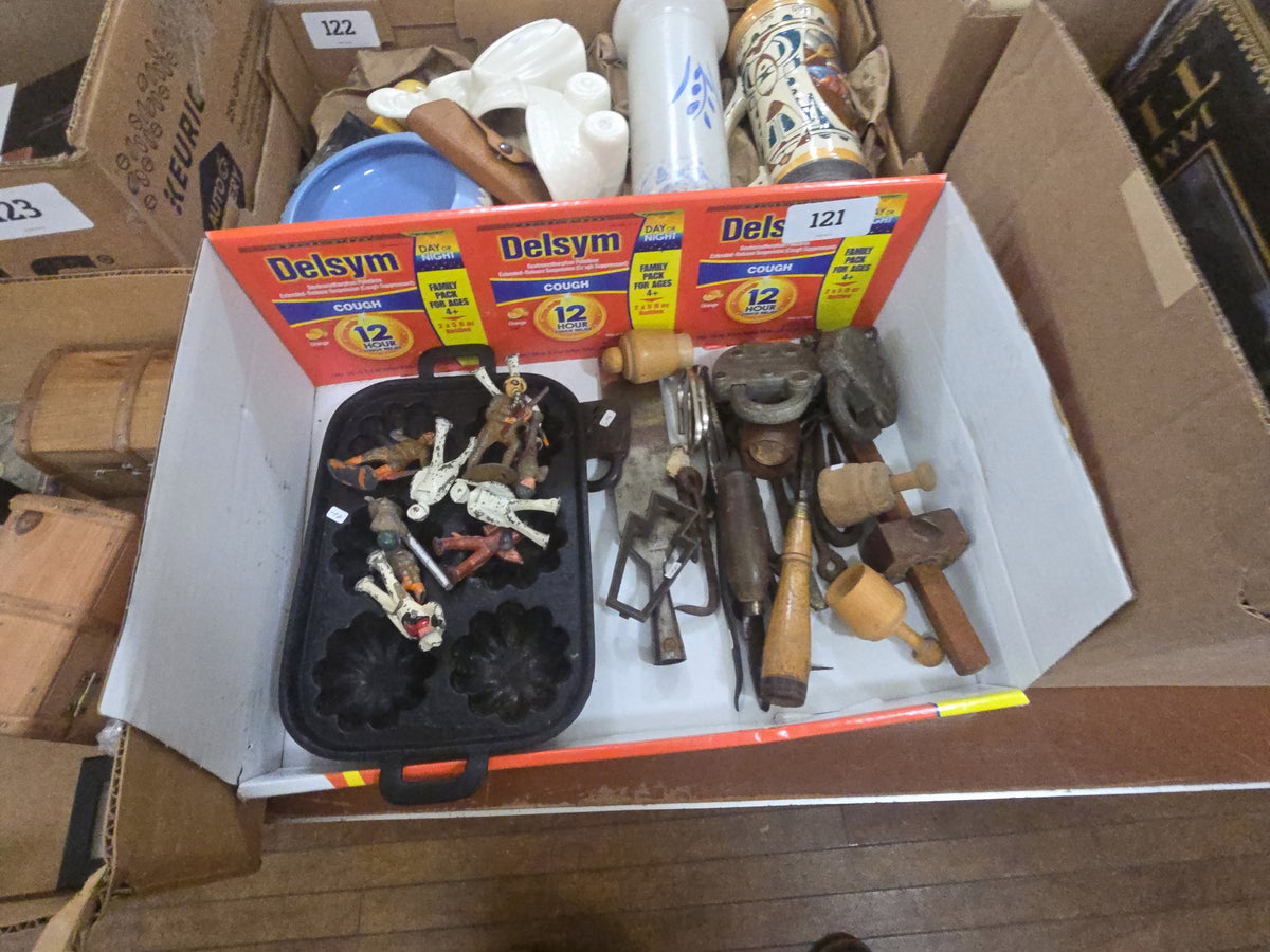 Box lot of miscellaneous metal objects including mold, toy soldiers, locks, and tools