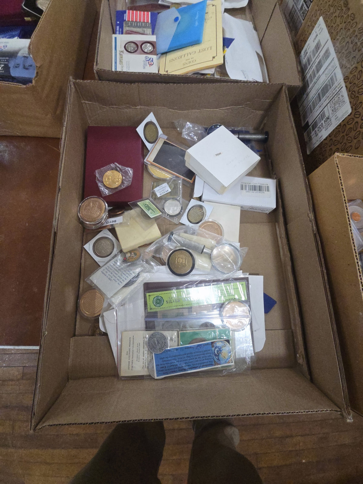 box lot of commemorative coins and collectibles