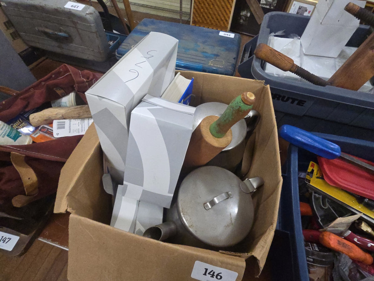box lot with kitchenware, book, and BMW parts