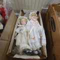 Lot 180 - Two Porcelain Dolls in Box with Bonnets