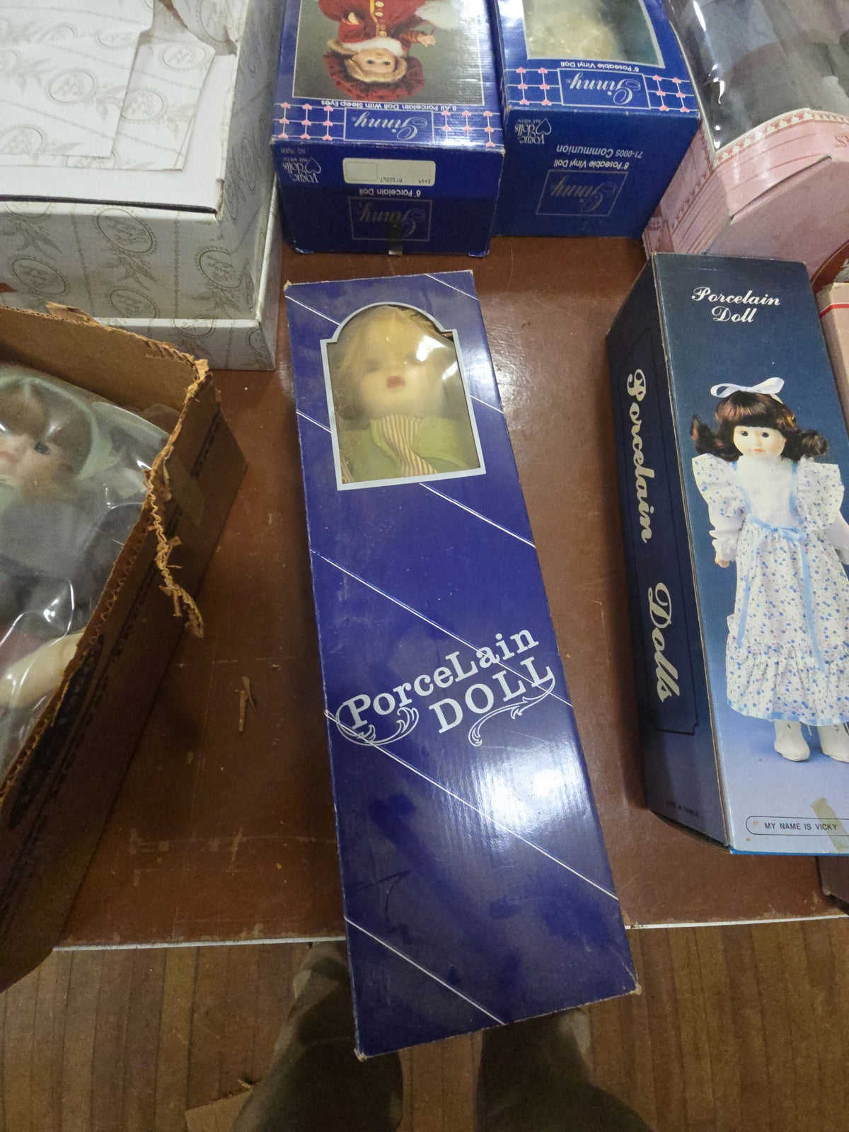 porcelain doll in blue box