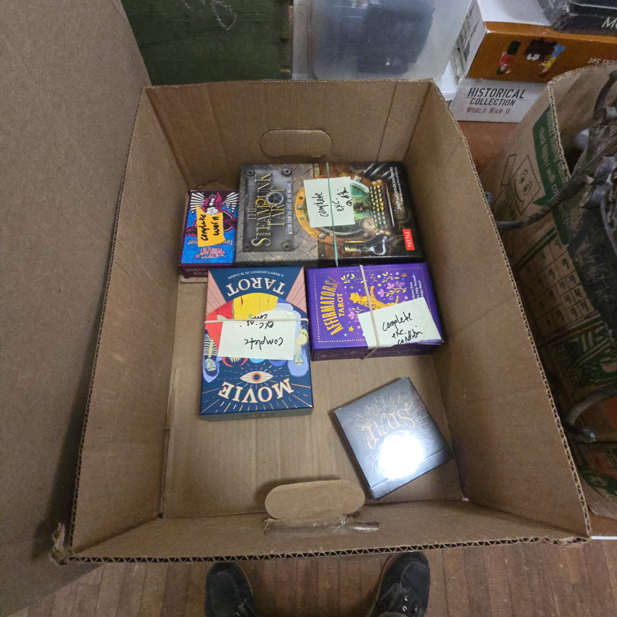 box lot of five modern tarot decks