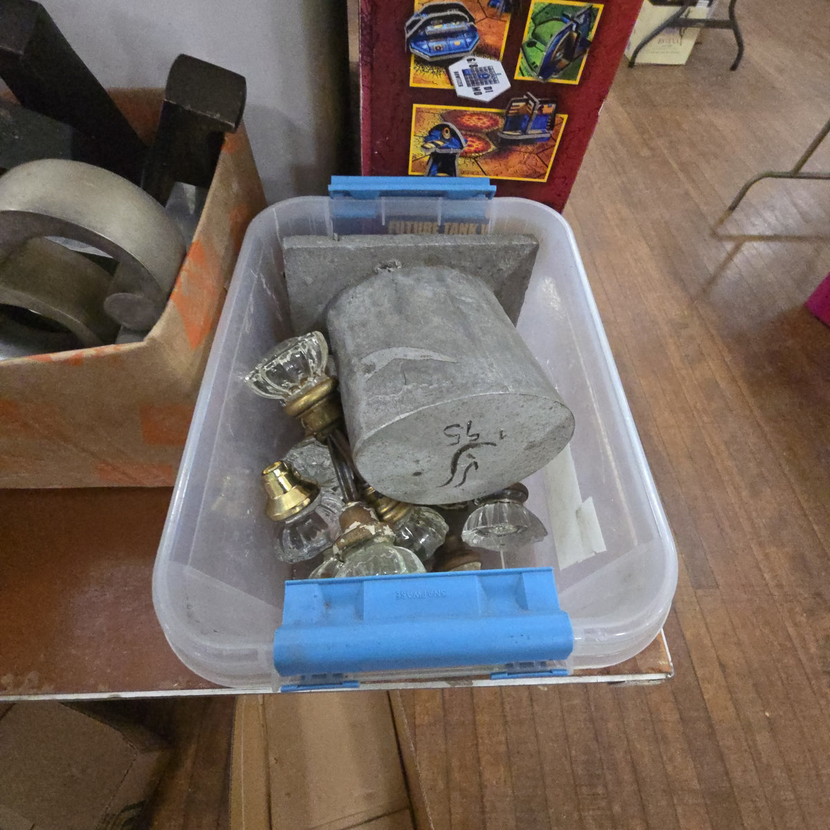 box lot with glass door knobs and aluminum piece