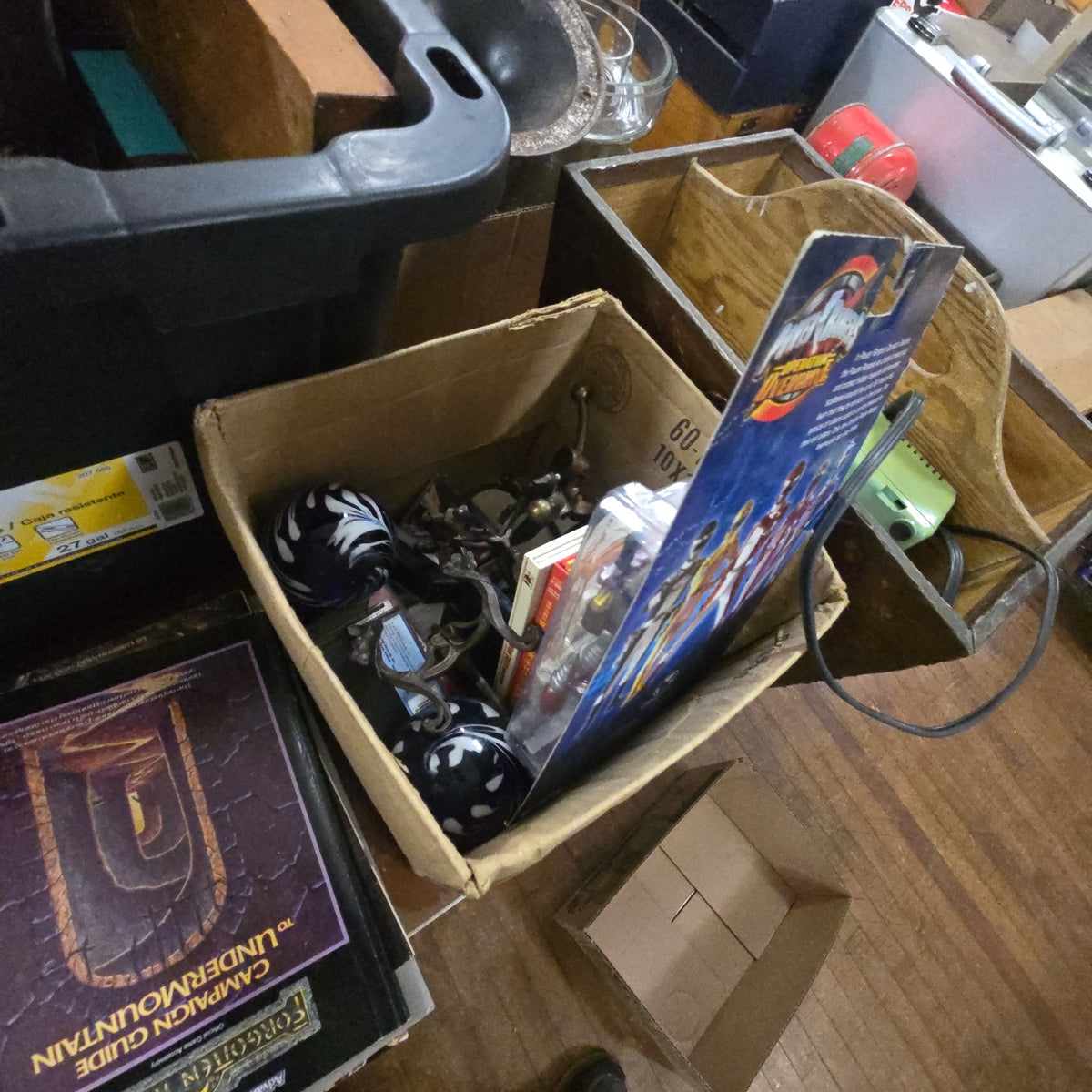 box lot of miscellaneous including paperweights, power rangers, and metal bases