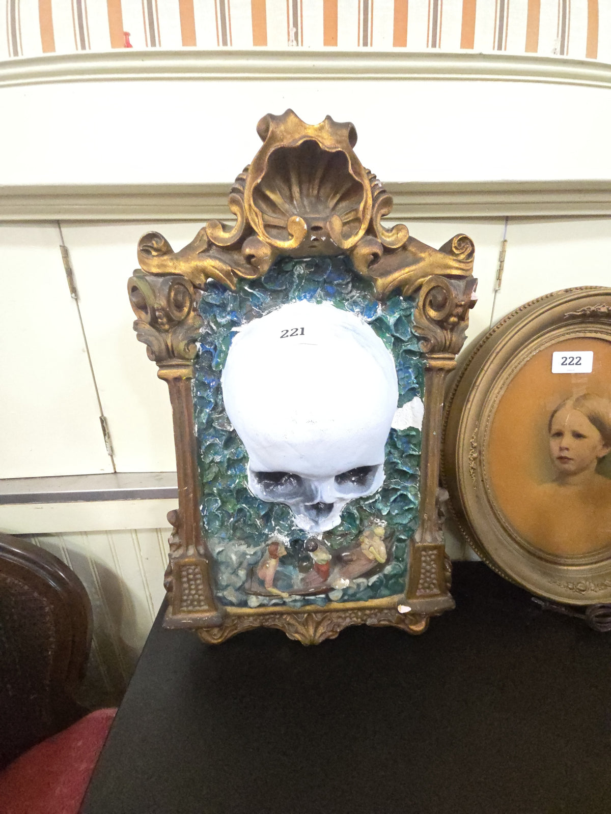 chalkware and plastic skull wall hanger with chips