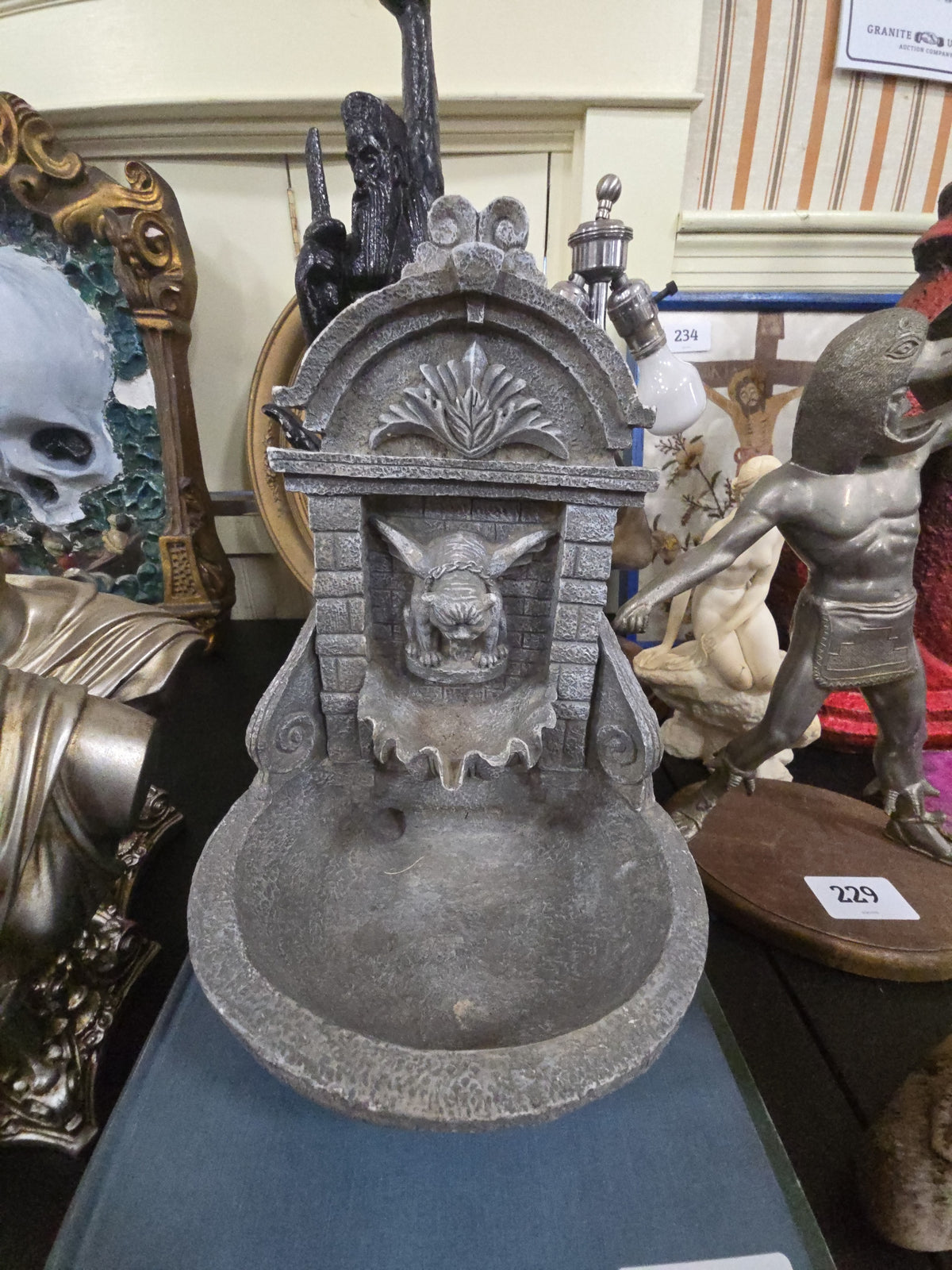 decorative fountain with gargoyle