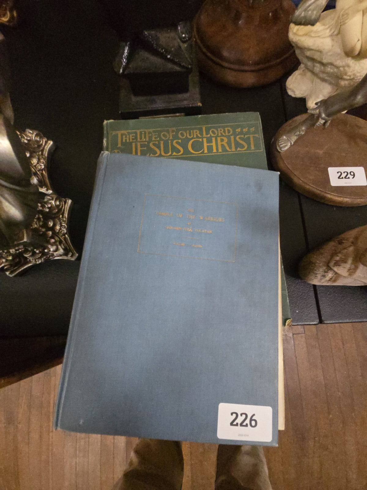 pair of books including the life of Jesus Christ and the Temple of the Warriors