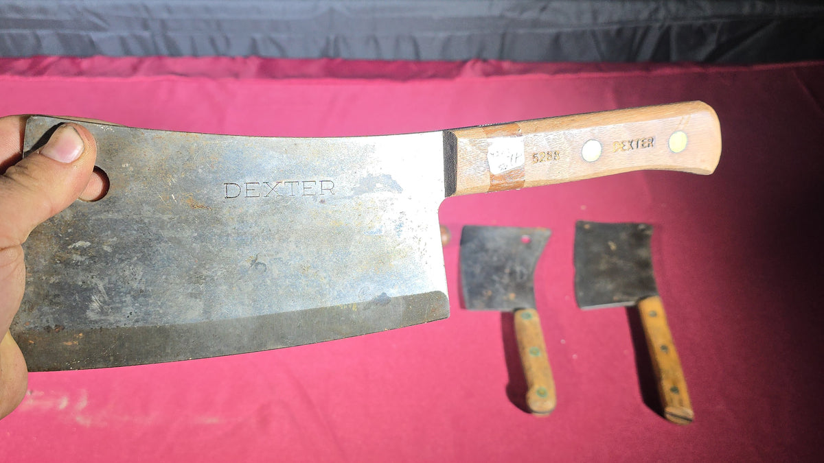 Grouping of Seven Antique and Vintage Meat Cleavers including Foster Bros., Dexter, Nichols Bros., and Russell