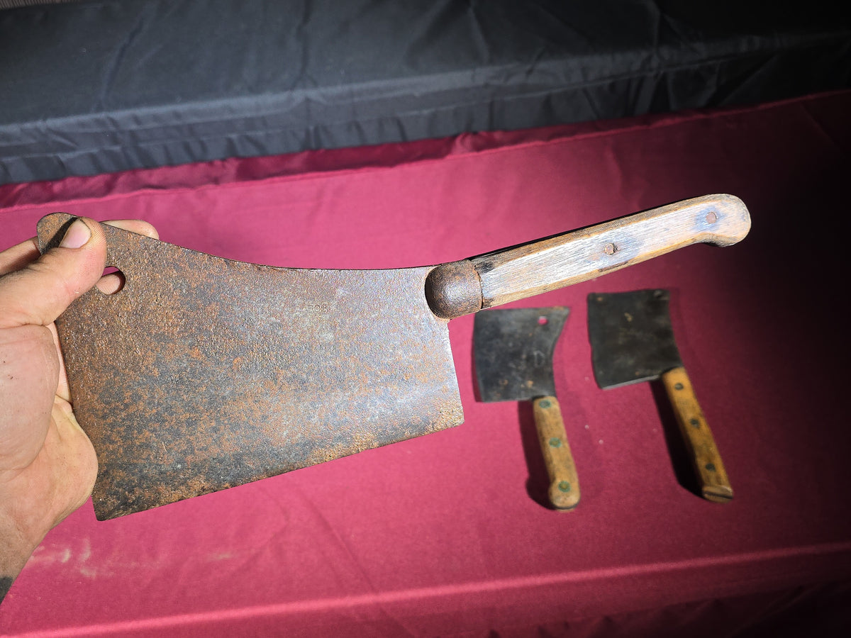 Grouping of Seven Antique and Vintage Meat Cleavers including Foster Bros., Dexter, Nichols Bros., and Russell