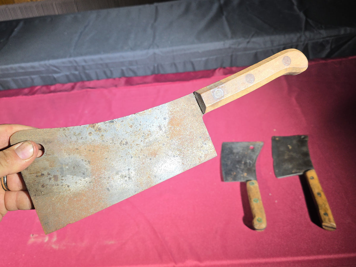 Grouping of Seven Antique and Vintage Meat Cleavers including Foster Bros., Dexter, Nichols Bros., and Russell