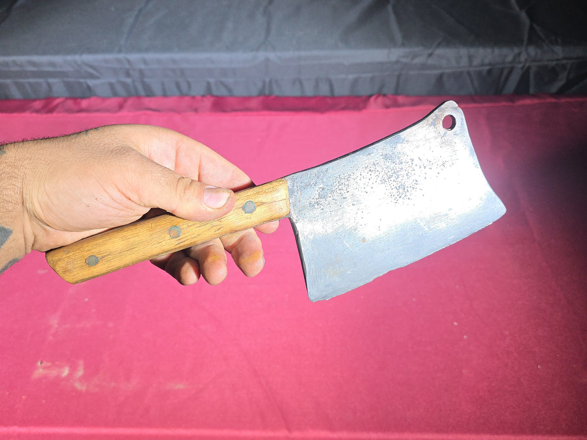 Grouping of Seven Antique and Vintage Meat Cleavers including Foster Bros., Dexter, Nichols Bros., and Russell