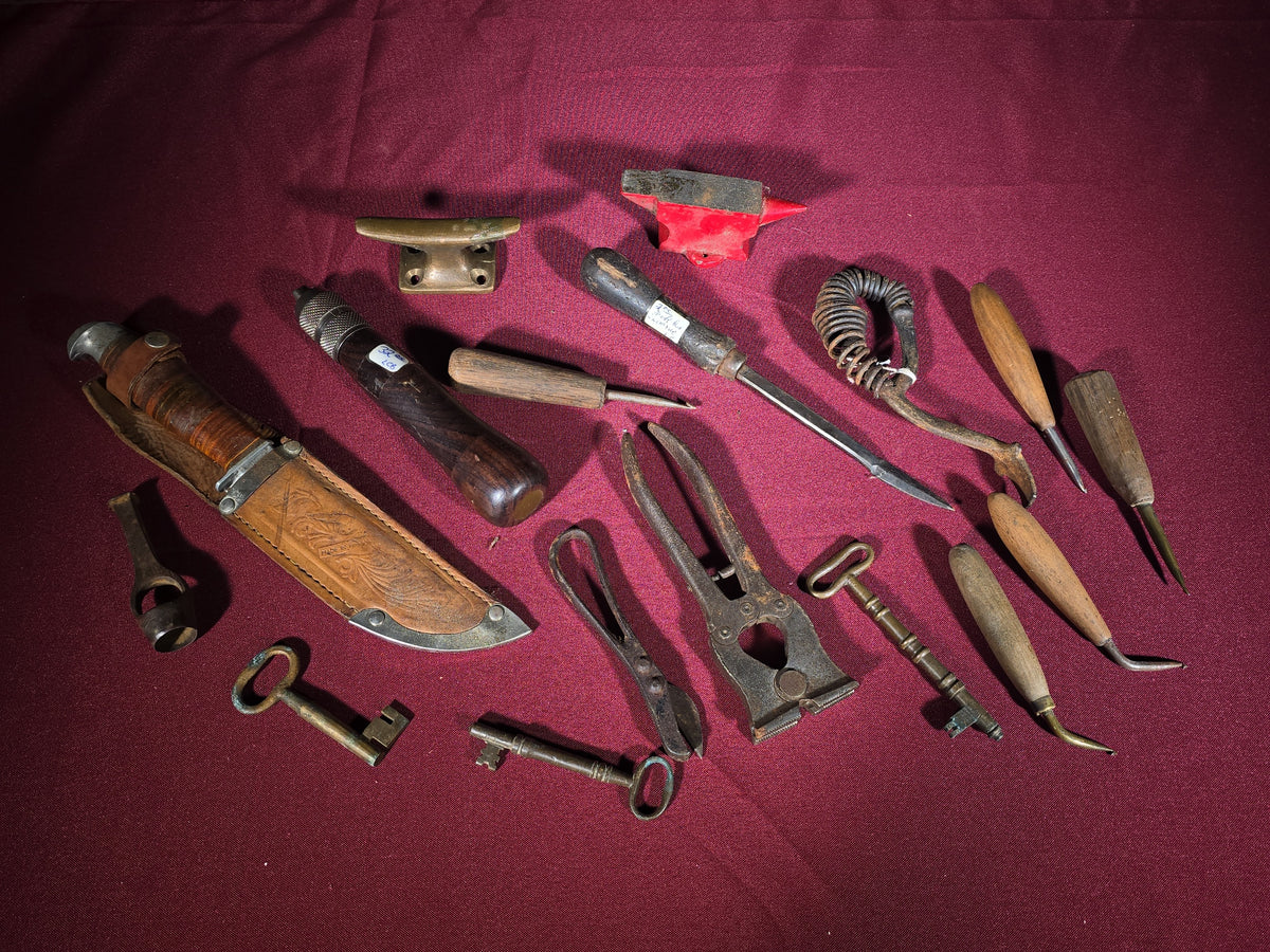 Grouping of Antique and Vintage Small Hand Tools and Hardware including Hunting Knife with Leather Sheath, Miniature Anvil, Dock Cleat, Skeleton Keys, and Awls
