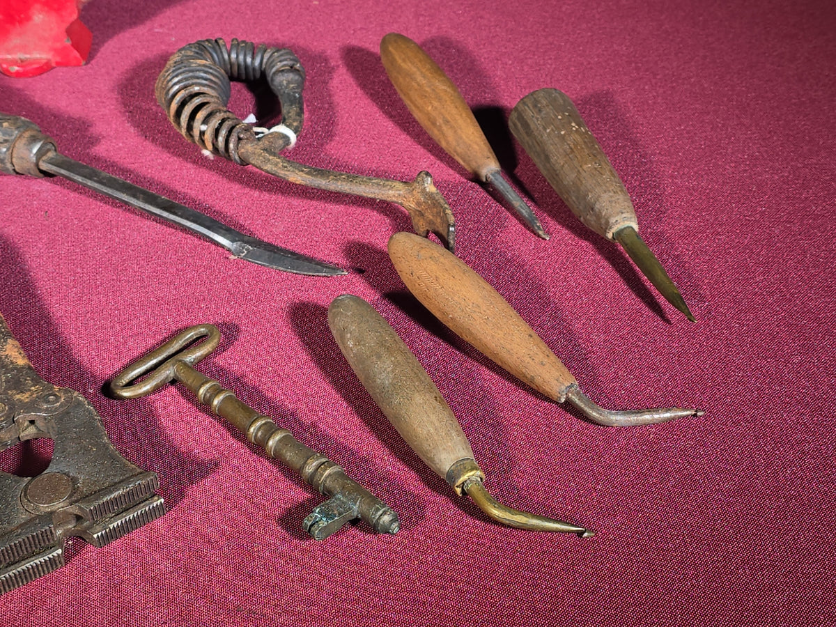 Grouping of Antique and Vintage Small Hand Tools and Hardware including Hunting Knife with Leather Sheath, Miniature Anvil, Dock Cleat, Skeleton Keys, and Awls