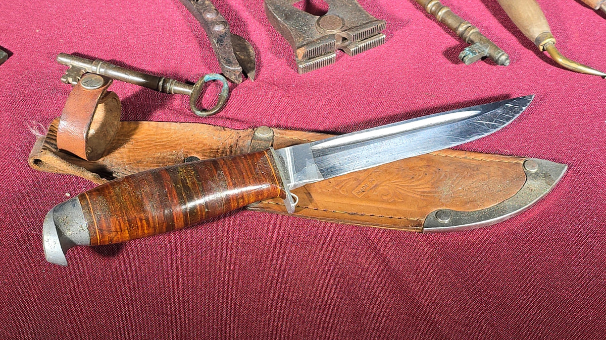 Grouping of Antique and Vintage Small Hand Tools and Hardware including Hunting Knife with Leather Sheath, Miniature Anvil, Dock Cleat, Skeleton Keys, and Awls