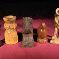 Lot 074 - Grouping of Five Vintage Hand-Carved Wood Figures Including a Guitar Player, Dog, Bird, and Figural Bust