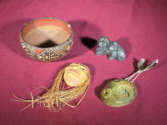 Grouping of Four Vintage and Antique Decorative Objects including Painted Pottery Bowl, Carved Stone Animal Figure, and Two Carved Masks