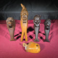 Lot 075 - Grouping of Five Antique Carved Wood Items Including Four Figural Nutcrackers and an Acorn-Form Cup