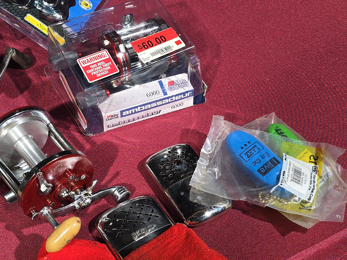 Grouping of 20+ Vintage and Modern Fishing Reels Including Penn Long Beach No. 60, Penn Jigmaster No. 500, Penn No. 155, Penn Hi-Surfer No. 160, Olympic Dolphin 612, Ocean City 113, South Bend Automatic, Abu Garcia Ambassadeur 6000, and More