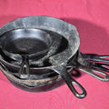 Lot 225 - Grouping of Five Antique and Vintage Cast Iron Skillets Including Griswold No. 7, Wagner Ware No. 8, and Wapak No. 8