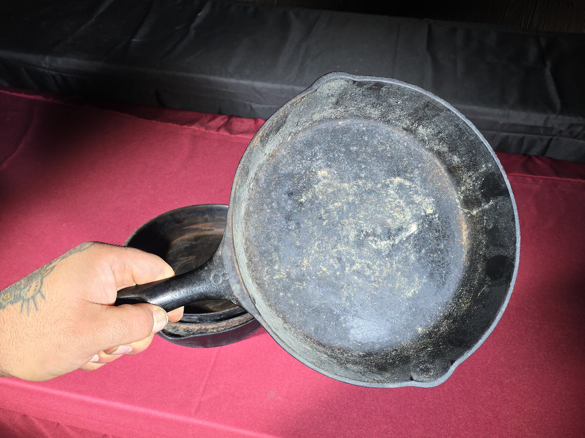 Grouping of Five Antique and Vintage Cast Iron Skillets including Griswold No. 7, Wagner Ware No. 8, and Wapak No. 8