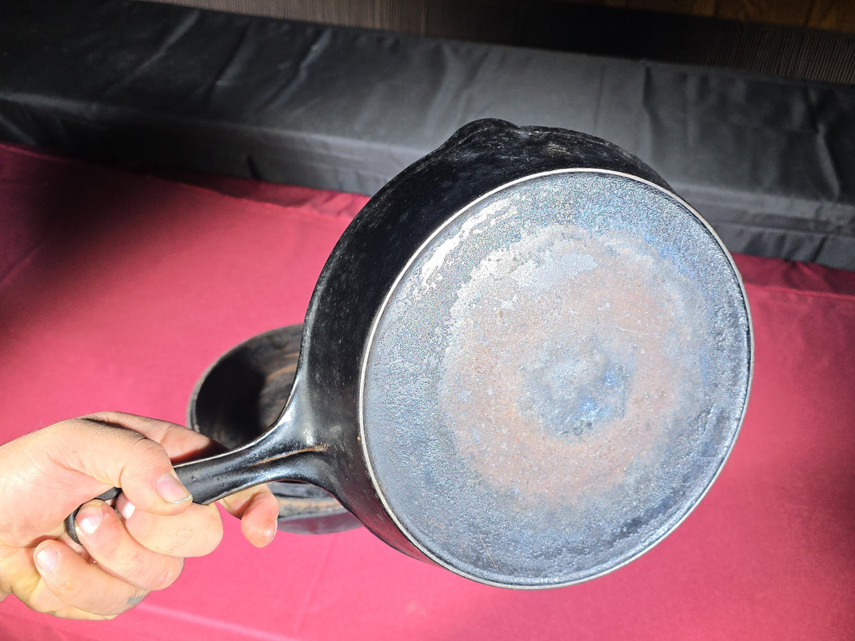 Grouping of Five Antique and Vintage Cast Iron Skillets including Griswold No. 7, Wagner Ware No. 8, and Wapak No. 8