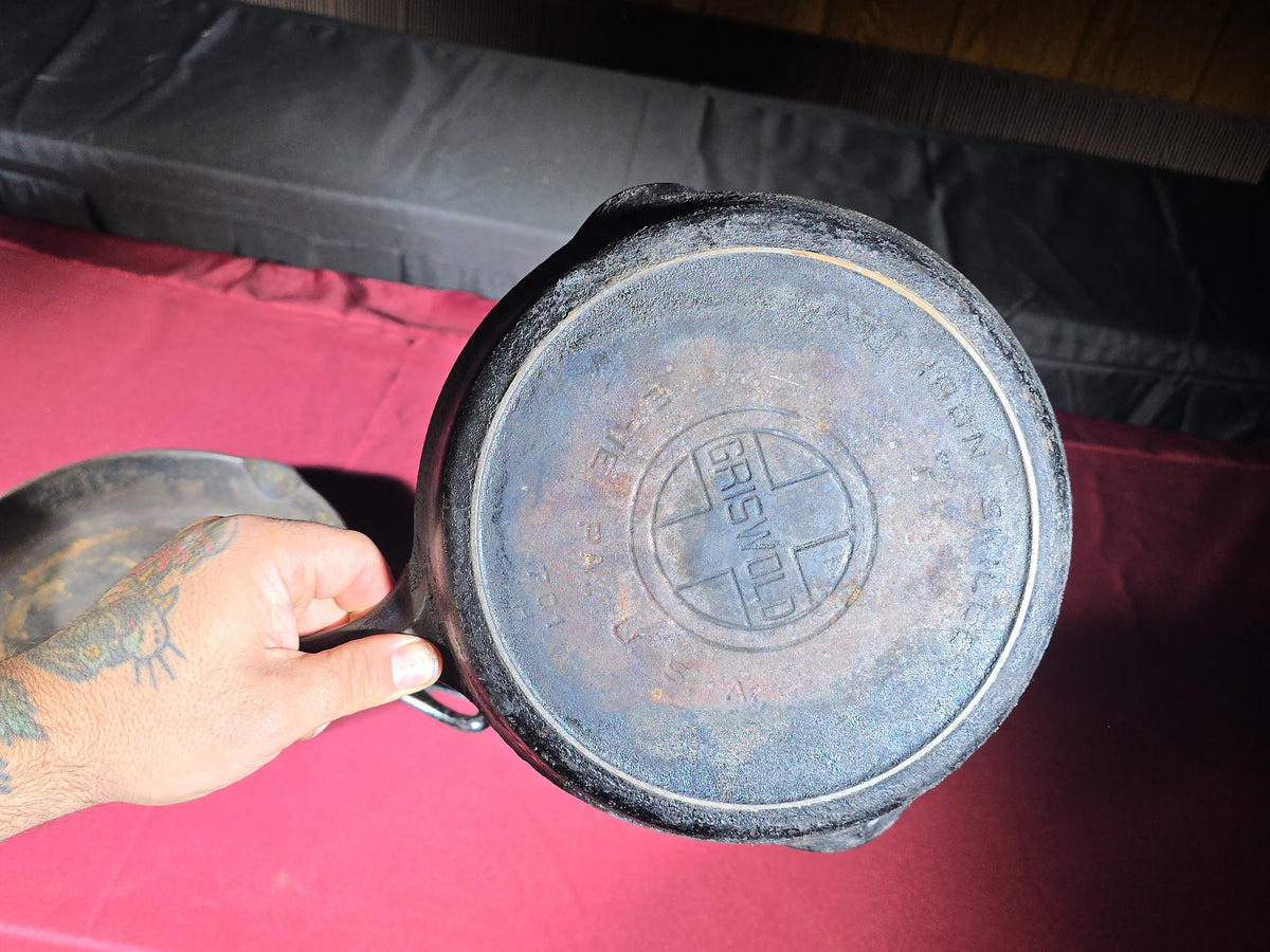 Grouping of Five Antique and Vintage Cast Iron Skillets including Griswold No. 7, Wagner Ware No. 8, and Wapak No. 8