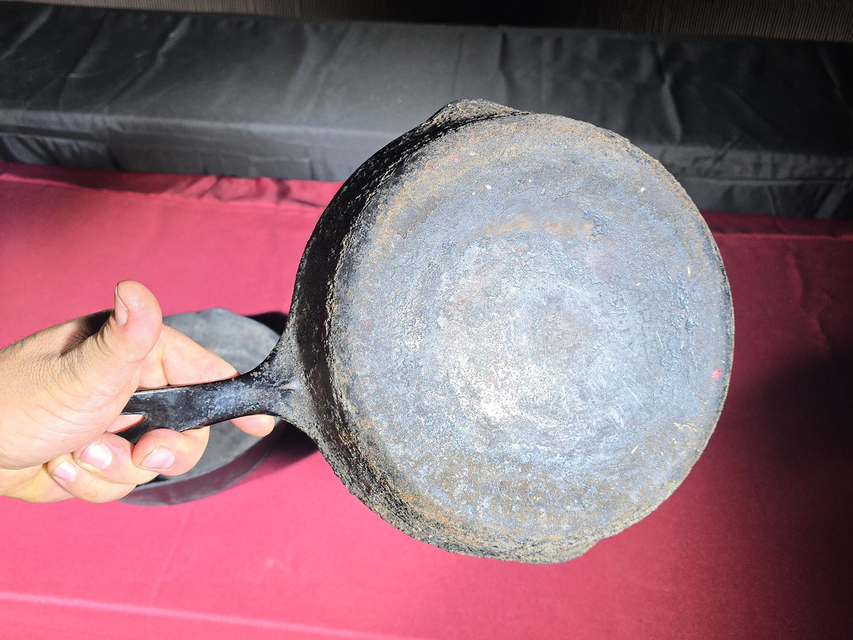 Grouping of Five Antique and Vintage Cast Iron Skillets including Griswold No. 7, Wagner Ware No. 8, and Wapak No. 8