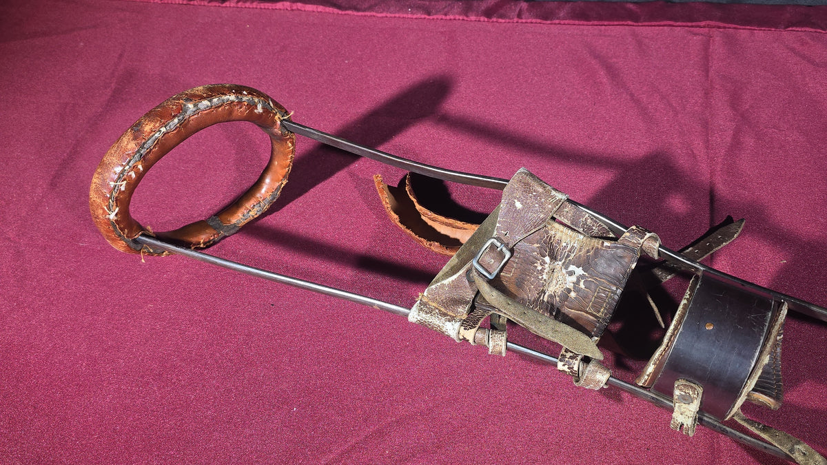 Antique Metal Frame Prosthetic Leg with Leather Straps and Padding