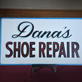 Lot 158 - Vintage Hand-Painted "Dana's Shoe Repair" Plastic Advertising Sign, 25-7/8" W x 14-3/4" H