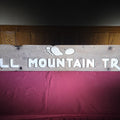Lot 163 - Vintage Carved and Painted Wooden "Hall Mountain Trail" Sign with Footprint Graphic, 69-1/2" L