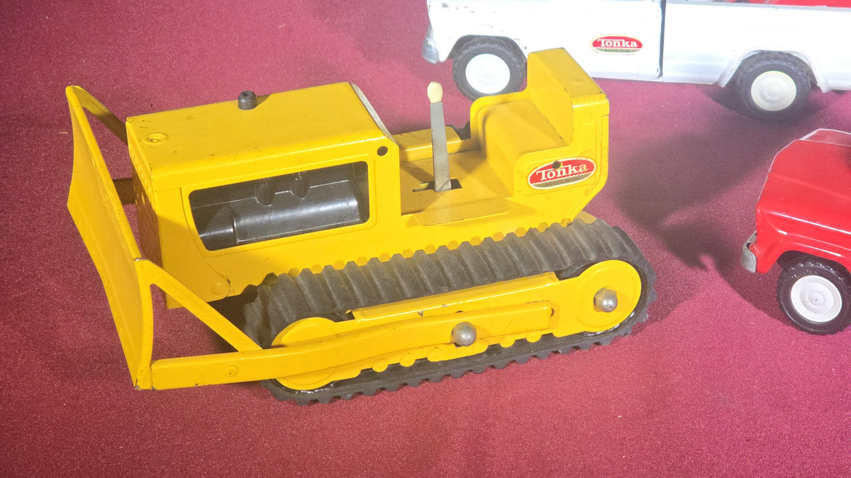 Trio of Vintage Pressed Steel Tonka Toys including Bulldozer, Dump Truck, and Tow Truck