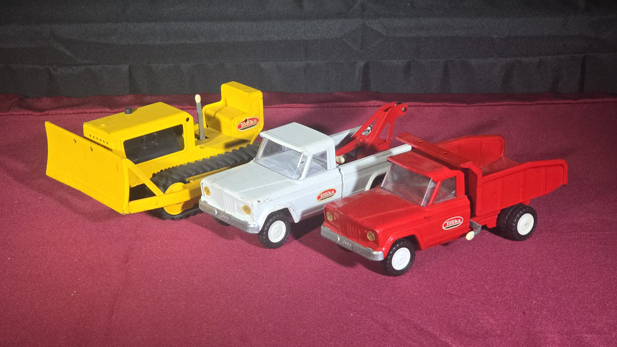 Trio of Vintage Pressed Steel Tonka Toys including Bulldozer, Dump Truck, and Tow Truck