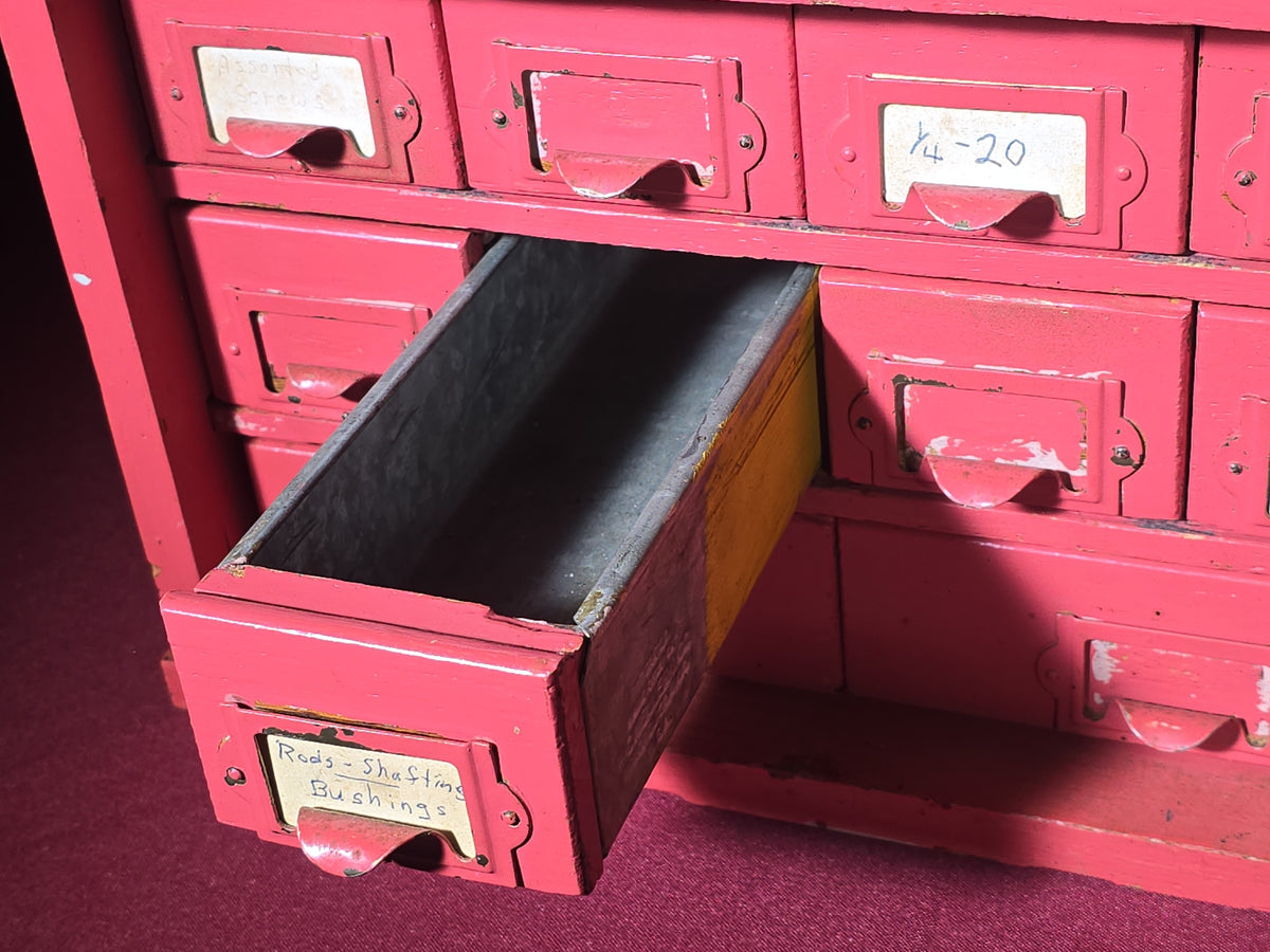 Vintage Pink-Painted Wooden Parts Cabinet with 18 Metal Drawers and Handwritten Labels