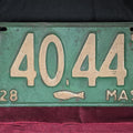 Lot 089 - Antique 1928 Massachusetts License Plate No. 140447 with Cod Fish Emblem