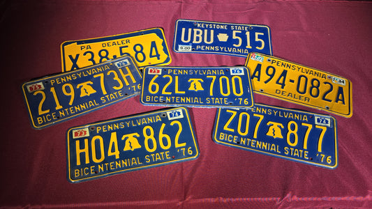 Grouping of Seven Vintage Pennsylvania License Plates including Bicentennial and Dealer Plates, 1970s–1980s