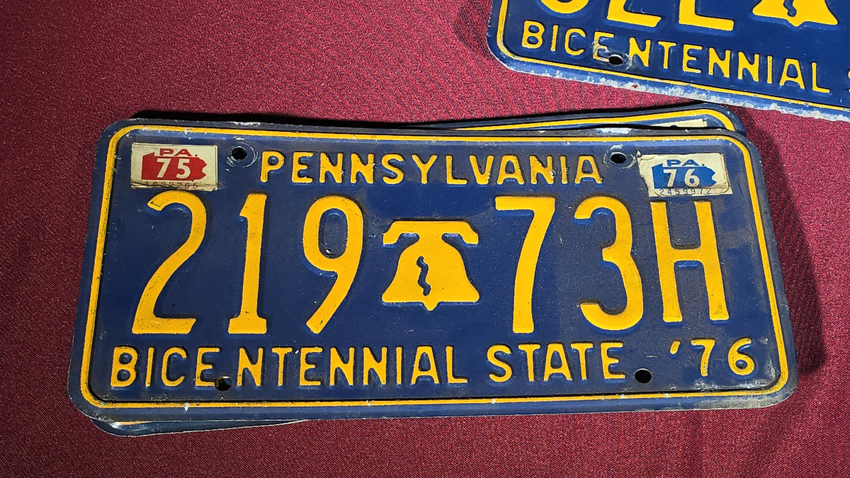 Grouping of Seven Vintage Pennsylvania License Plates including Bicentennial and Dealer Plates, 1970s–1980s