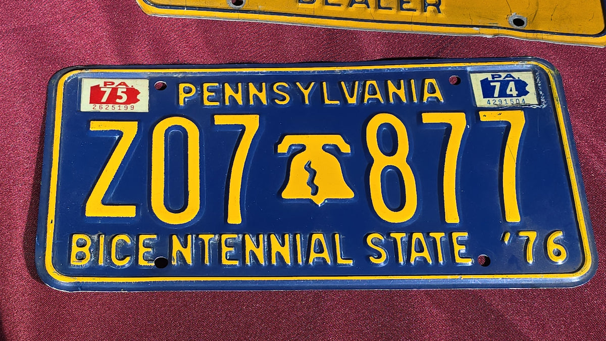 Grouping of Seven Vintage Pennsylvania License Plates including Bicentennial and Dealer Plates, 1970s–1980s