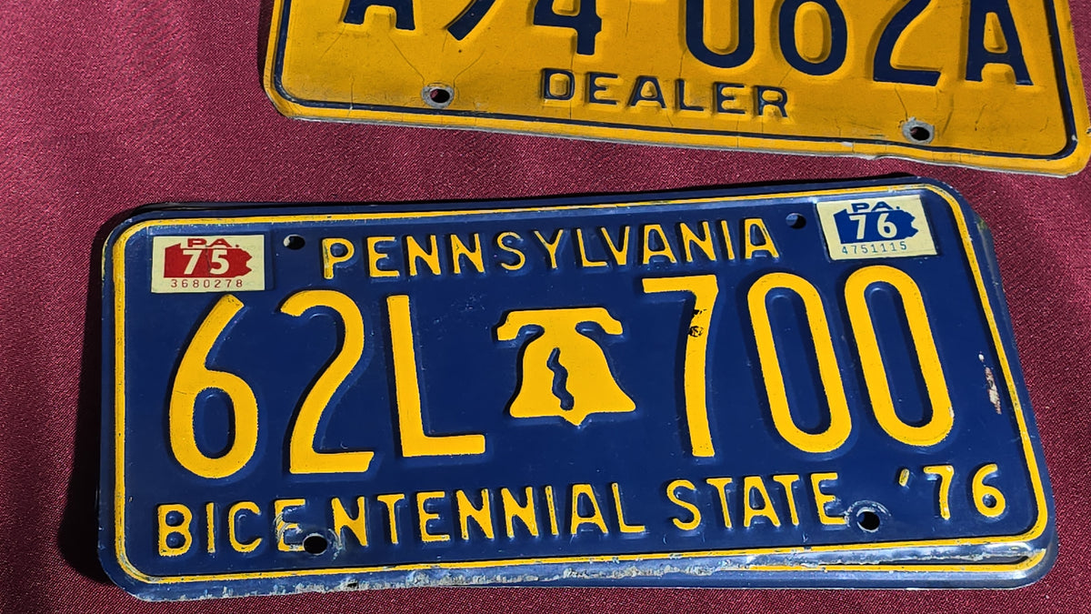 Grouping of Seven Vintage Pennsylvania License Plates including Bicentennial and Dealer Plates, 1970s–1980s